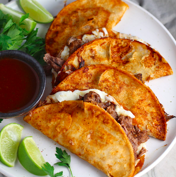 Mexican: Birria Tacos, Cilantro Rice, Refried Beans, Tres Leches Cake