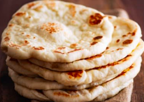 Indian: Chicken Tikka, Green Chutney, Naan, Salad, Yellow Rice, Mango Lassi
