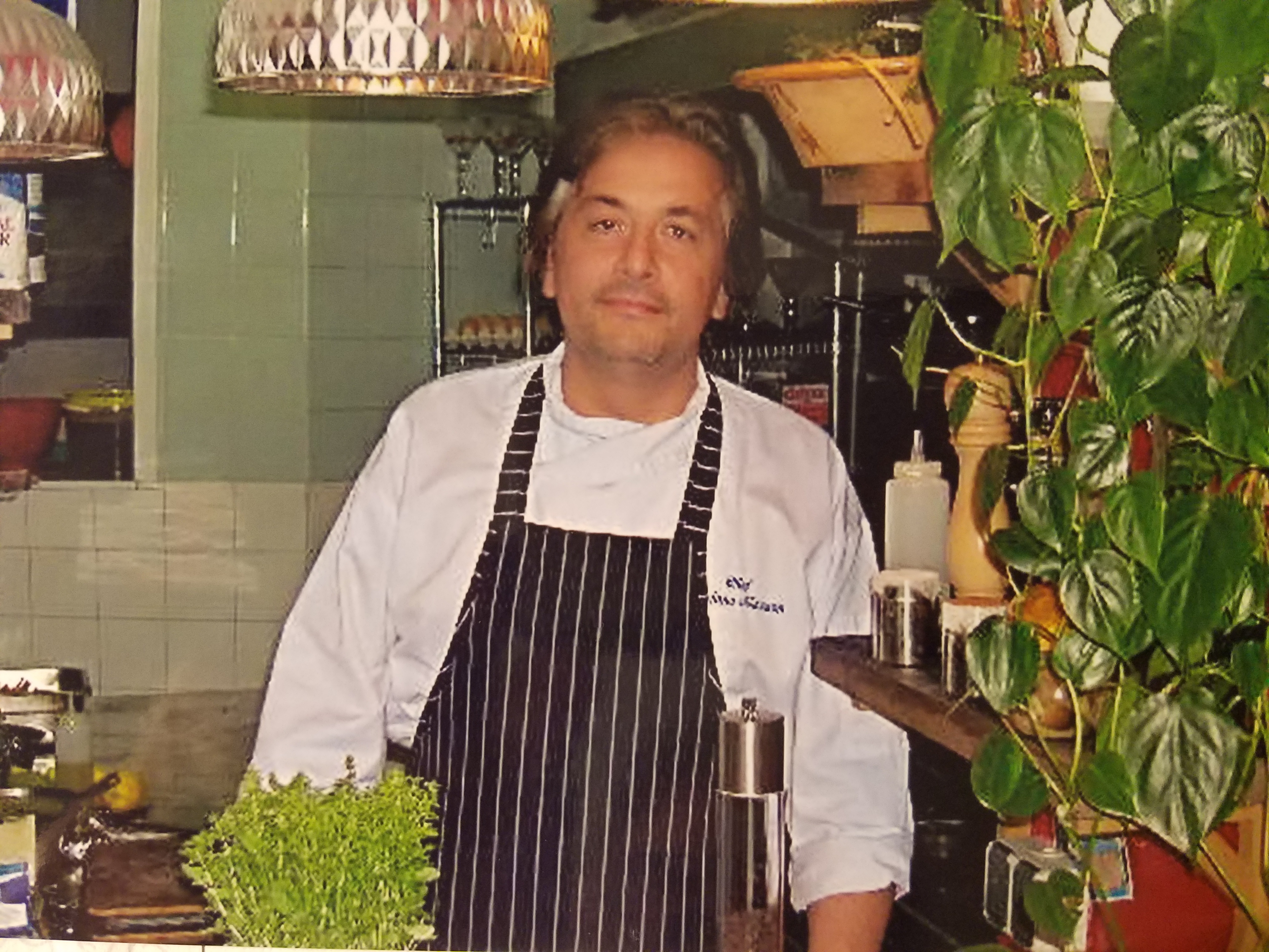 Chef Stefano Mazzon in his element, welcoming guests to his restaurant."