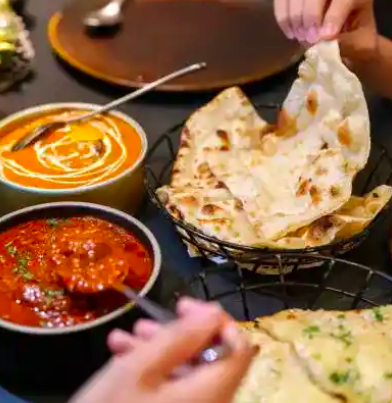 Classic Indian Cuisine: Butter Chicken and Handmade Naan