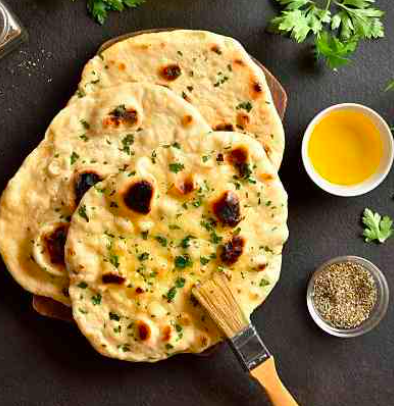 Classic Indian Cuisine: Butter Chicken and Handmade Naan